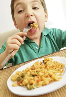 Balanced Diet For Children Prints: Boy eats pasta dish