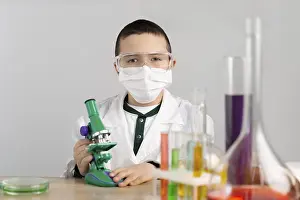 Laboratory Equipment Prints: Boy laboratory with microscope