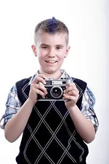 Dark Studio Shot Prints: Boy with old camera