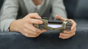 Child Playing Video Games Prints: Boy playing with controller