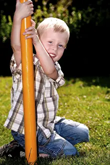 Caucasian Boy Smiling Prints: Boy playing on the playground