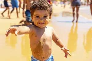 Atlantic Ocean Coastline Scene Prints: Boy playing in the sand and having fun