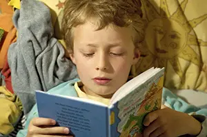 Education For Kids Prints: Boy reading in bed