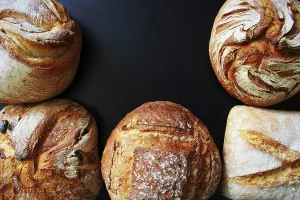 Bread Assortment Prints: Bread. Assortment of different types of bread on a blackn background