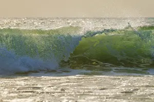 Powerful Ocean Breaker Prints: Breaking ocean wave on sunset backlit with sun