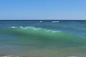 Tarragona Beach Prints: Breaking waves on a beach, sunny