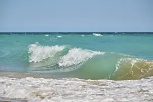 Empty Sandy Ocean Beach Prints: Breaking waves on a sandy beach