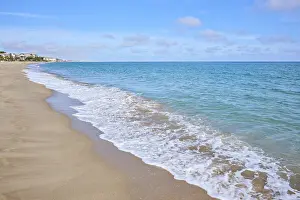 Tarragona Beach Prints: Breaking waves on a sandy beach