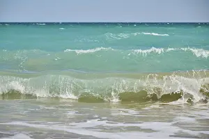 Spanish Sandy Beaches Prints: Breaking waves on a sandy beach