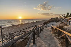 Evening Light In Spain Prints: A breathtaking sunset on the beach