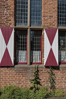 Red And White Shutters Prints: Brick wall with mullioned windows