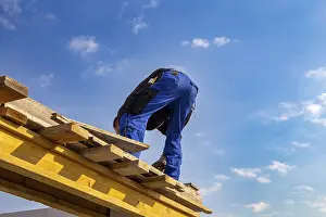 Newly Constructed Residential Buildings Prints: Bricklayer working on a new apartment building