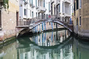 Deserted Waterway In Italy Prints: Bridge with reflection in canal