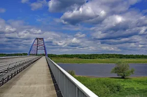 Central Europe Landscape Image Prints: Bridge over a river under a cloudy blue sky