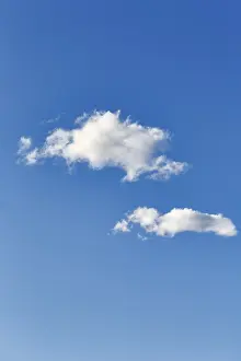 Cloudy Scandinavian Sky Prints: Bright blue sky with two clouds