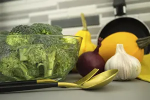 Kitchen Table Setup Prints: Broccoli preparation for cooking on the kitchen table