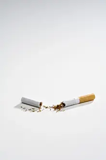 Broken Cigarette Prints: Broken cigarette split into two, split in half