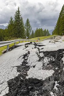 Deserted Mountain Roads Prints: Broken road with cracks in the road surface