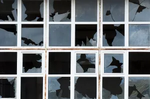 Broken Windows Prints: Broken windows of old building. White frames