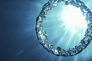 Underwater Ring Prints: Bubble Ring Underwater ascends towards the Sun