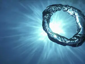 Underwater Ring Prints: Bubble Ring Underwater ascends towards the Sun