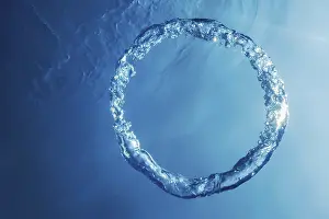 Deserted Ocean Scene Prints: Bubble Ring Underwater ascends towards the Sun