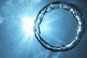 Deserted Underwater World Prints: Bubble ring Underwater ascends towards the sun