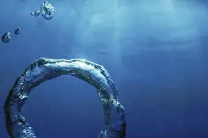 Underwater Ring Prints: Bubble Ring Underwater ascends towards the Sun