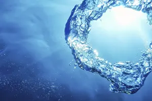 Underwater Ring Prints: Bubble Ring Underwater ascends towards the Sun