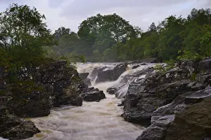 Scenic Scottish Landscapes Prints: A bubbling river flows through a tree-lined