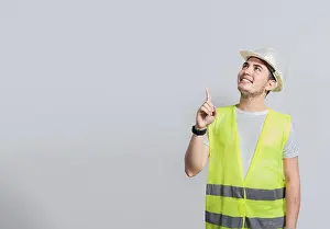 Construction Industry Professional Prints: Builder engineer pointing finger to the right isolated