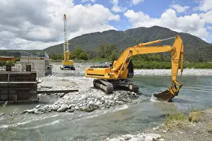 Concrete Bridge Construction Prints: Builders create a new channel to control the river while they construct a concrete bridge over a small river