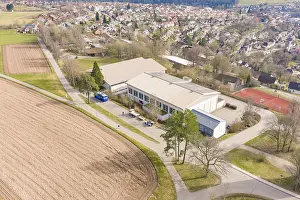 Uninhabited Farm Land Prints: Building complex on the outskirts of town with adjacent fields and trees