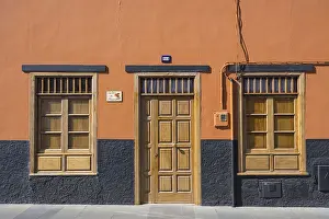 Deserted Urban Environment Photo Prints: A building facade with an orange wall