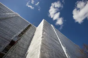 Abandoned Construction Site Prints: A building wrapped in plastic