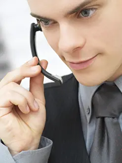 Businessman On Phone Prints: Businessman using a headset
