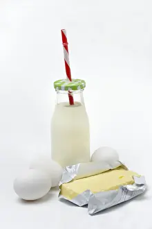 Grocery Store Backgrounds Prints: Butter in opened packaging, eggs and bottle of milk