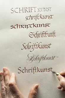 Calligrapher In Upper Bavaria Prints: Calligraphy studio, hand writes text with ink