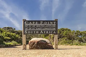 Cape Town Travel Photography Prints: Cape Point sign with coordinates next to the lighthouse path with stunning clouds