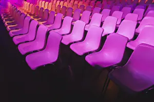 Interior Decoration Ideas Prints: A captivating array of pink chairs in neat rows