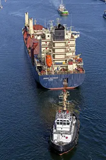 Transporting Goods By Sea Prints: Cargo ship waiting in front of the lock