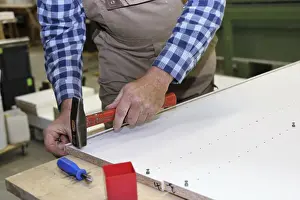 Carpenter At Work Prints: Carpenter at work in his carpentry workshop