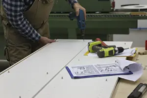 Woodworking Equipment Prints: Carpenter at work in his carpentry workshop