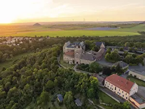 Deserted Castle Evening Prints: A castle surrounded by forests and fields at sunset