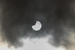 European Weather Forecast Prints: A partial solar eclipse occurs when the moon eclipses part of the sun and is surrounded by dynamic cloud formations