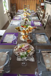 Decorative Tableware Prints: A long table with a table setting in a rustic room