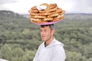 Asia Minor Landmarks Prints: Man carrying a stack of flatbreads on his head