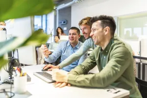 Bright Office Workspace Prints: Programmers collaborating on code in a bright