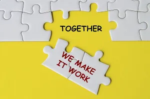 Team Collaboration Concept Prints: Together We Make It Work text on missing jigsaw puzzle representing teamwork and unity