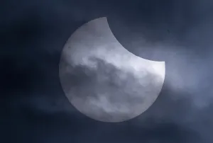 Solar Eclipse Germany Prints: Partial solar eclipse with clouds in the sky